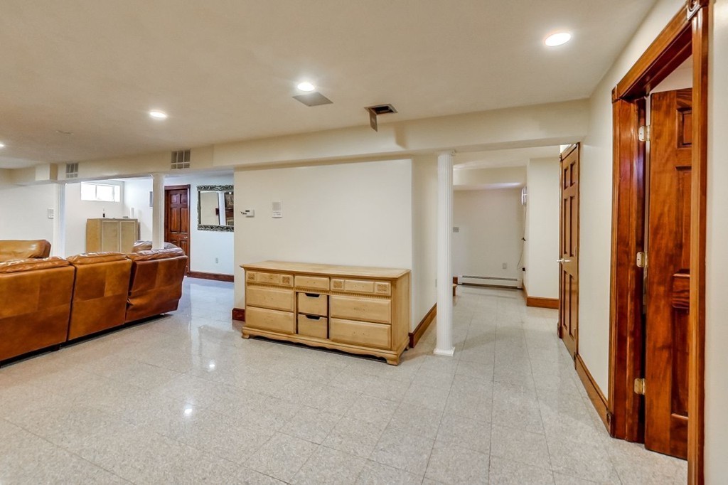 131 Range Heights Road Lynn, MA 01904 - Photo 29 of 30 a bedroom with furniture and a bed