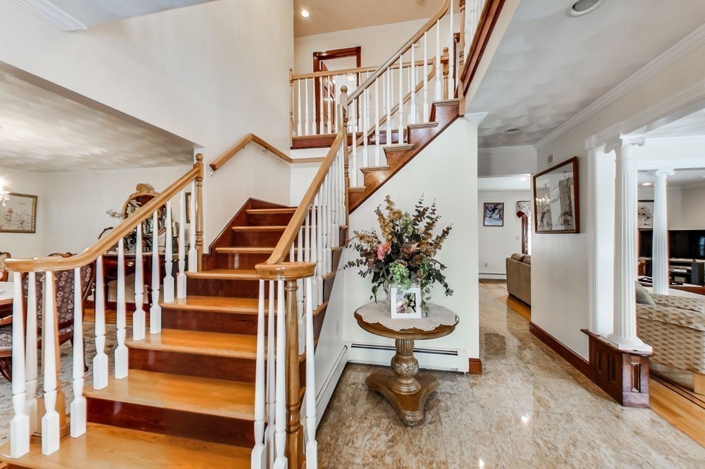 131 Range Heights Road Lynn, MA 01904 - Photo 3 of 30 a living room with wooden floor and stairs