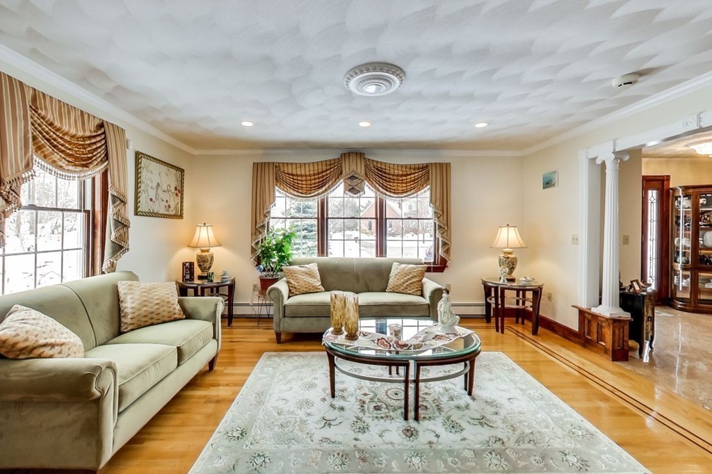 131 Range Heights Road Lynn, MA 01904 - Photo 4 of 30 a living room with furniture a rug and a large window