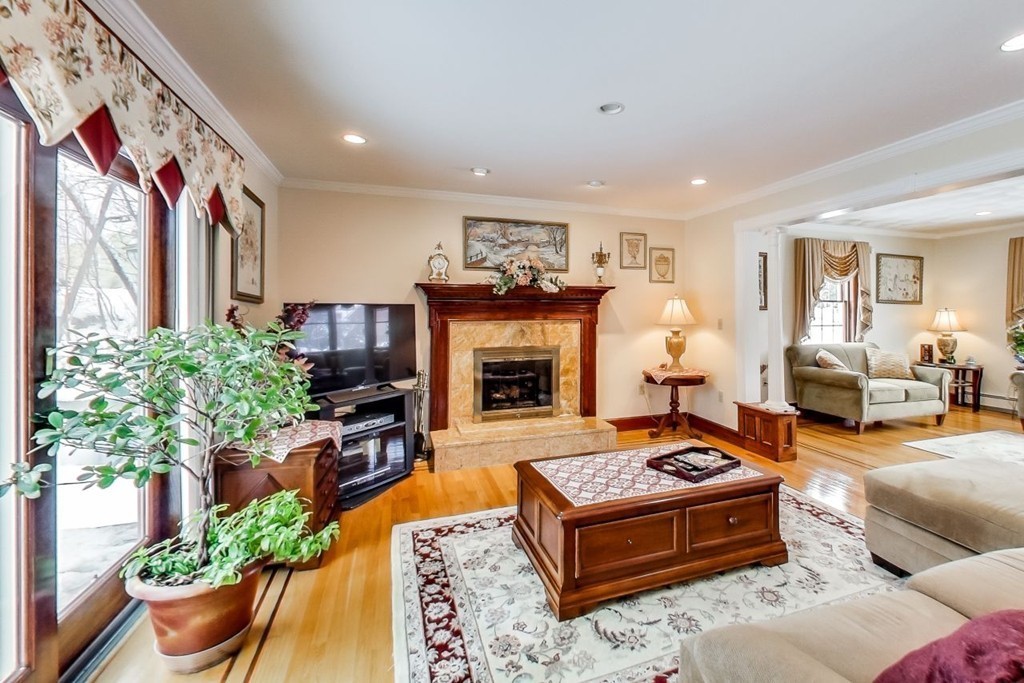 131 Range Heights Road Lynn, MA 01904 - Photo 5 of 30 a living room with furniture fireplace and a large window