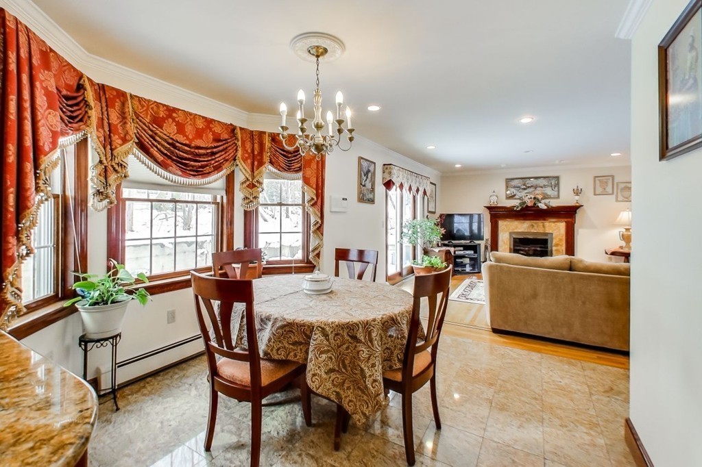 131 Range Heights Road Lynn, MA 01904 - Photo 8 of 30 a view of a dining room with furniture and a chandelier