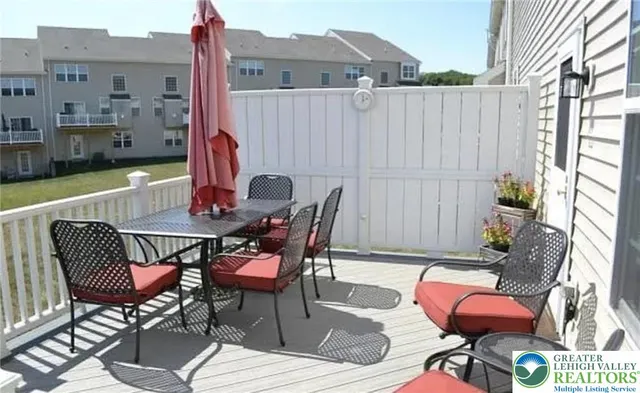 a view of a patio with a table and chairs