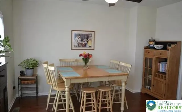 a view of a dining room with furniture and chandelier