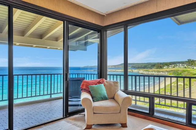 a balcony with furniture and city view