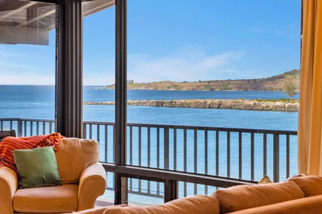 a balcony of a house with wooden floor