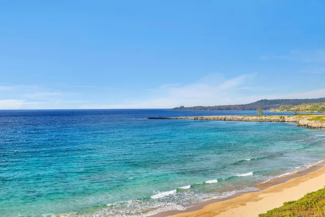 a view of a swimming pool with a table and chairs