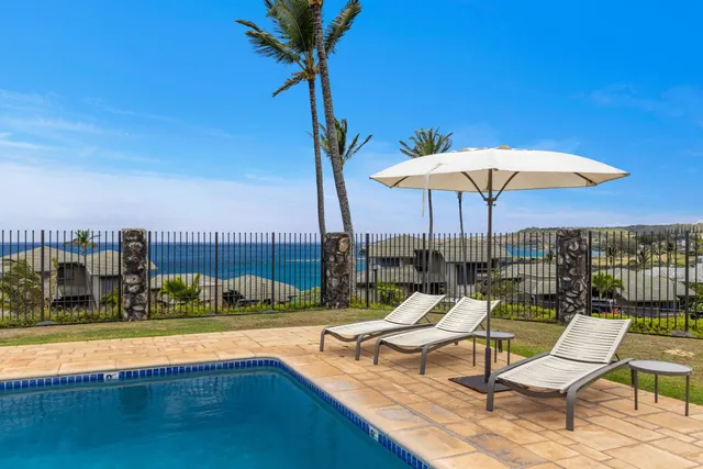 a view of a swimming pool with a lake view