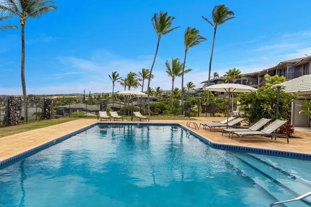 a view of swimming pool with seating space