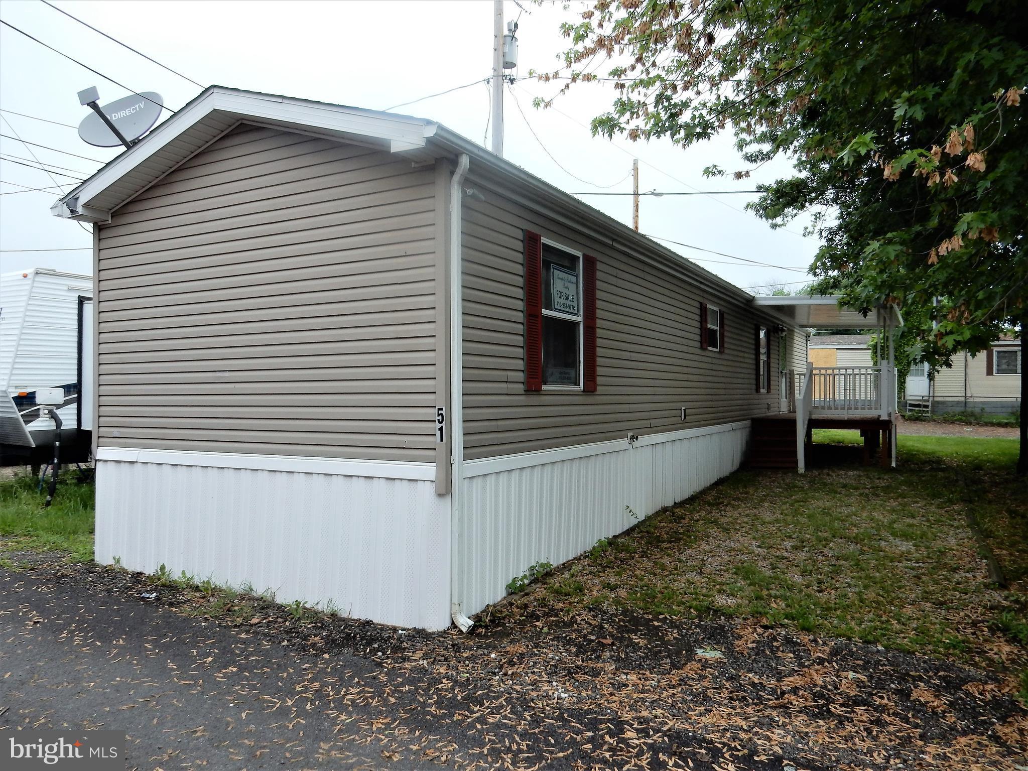8545 Pulaski Highway Rosedale, MD 21237 - Photo 1 of 17 a view of a house with a yard