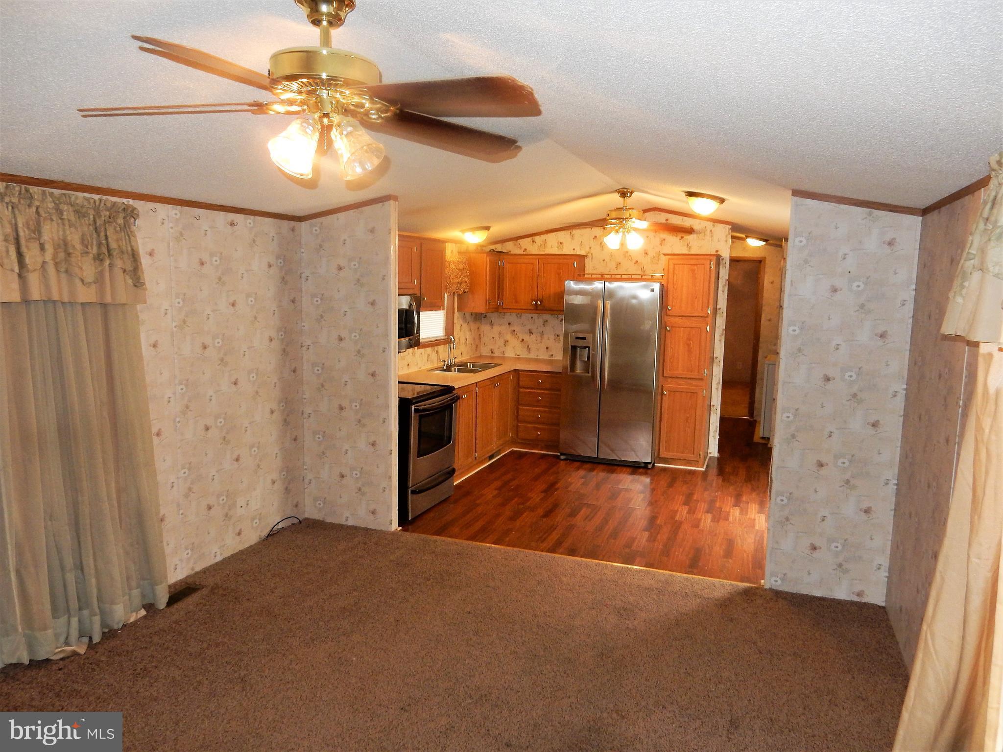 8545 Pulaski Highway Rosedale, MD 21237 - Photo 4 of 17 a view of a hallway with wooden floor
