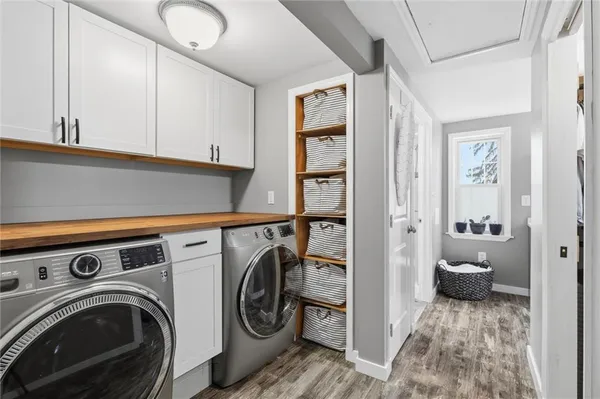 a view of a hallway with washer and dryer
