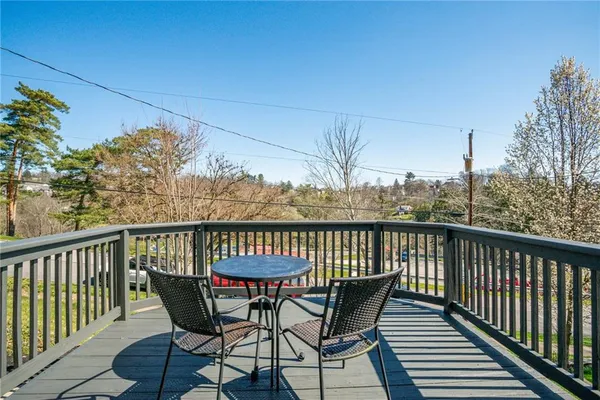 a view of a chairs on wooden deck