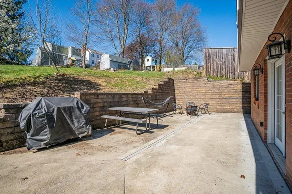 a view of a backyard with wooden fence