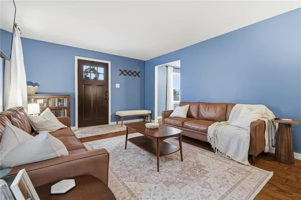 a living room with furniture and a rug