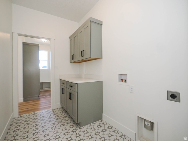 3938 North Wood Road Eagle Mountain, UT 84005 - Photo 29 of 55 Laundry area with hookup for a washing machine, cabinet space, and hookup for an electric dryer
