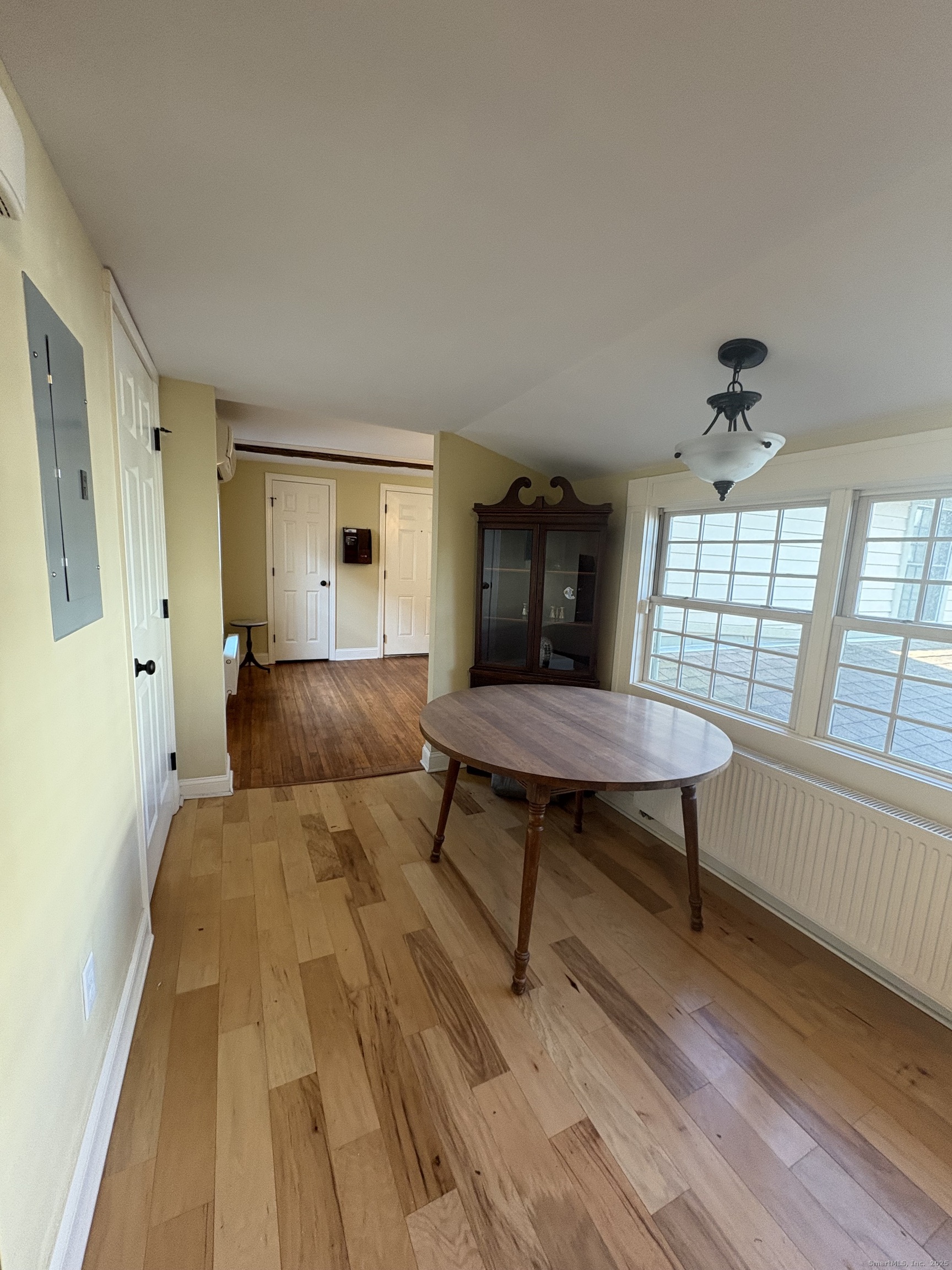 7 Coit Street, Unit 2 New London, CT 06320 - Photo 7 of 19 a bedroom with a bed and a window