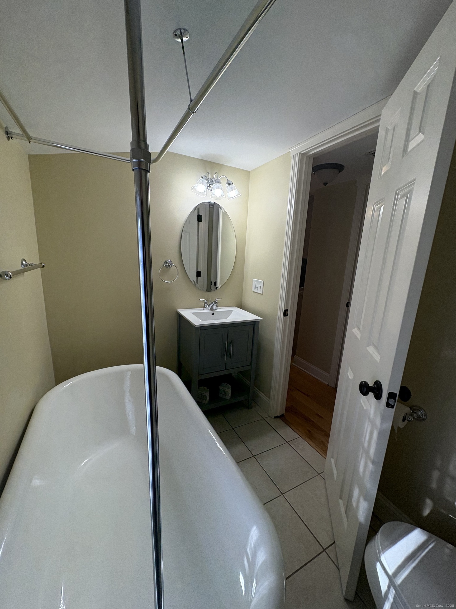 7 Coit Street, Unit 2 New London, CT 06320 - Photo 9 of 19 a bathroom with a sink a toilet and shower