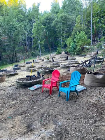 a view of a backyard with sitting area