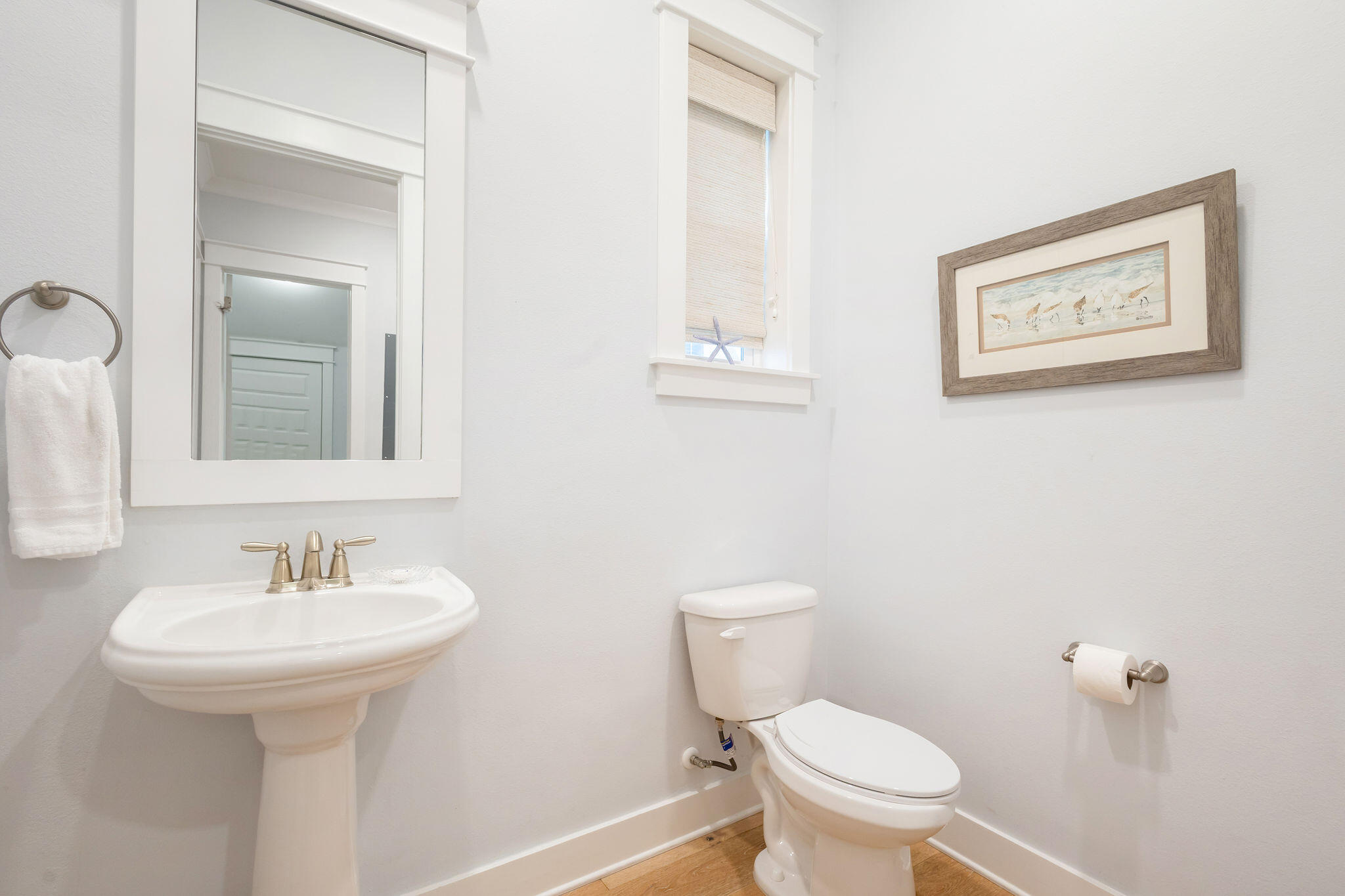 26 East E Pine, Unit A Inlet Beach, FL 32461 - Photo 21 of 53 a bathroom with a toilet sink and mirror