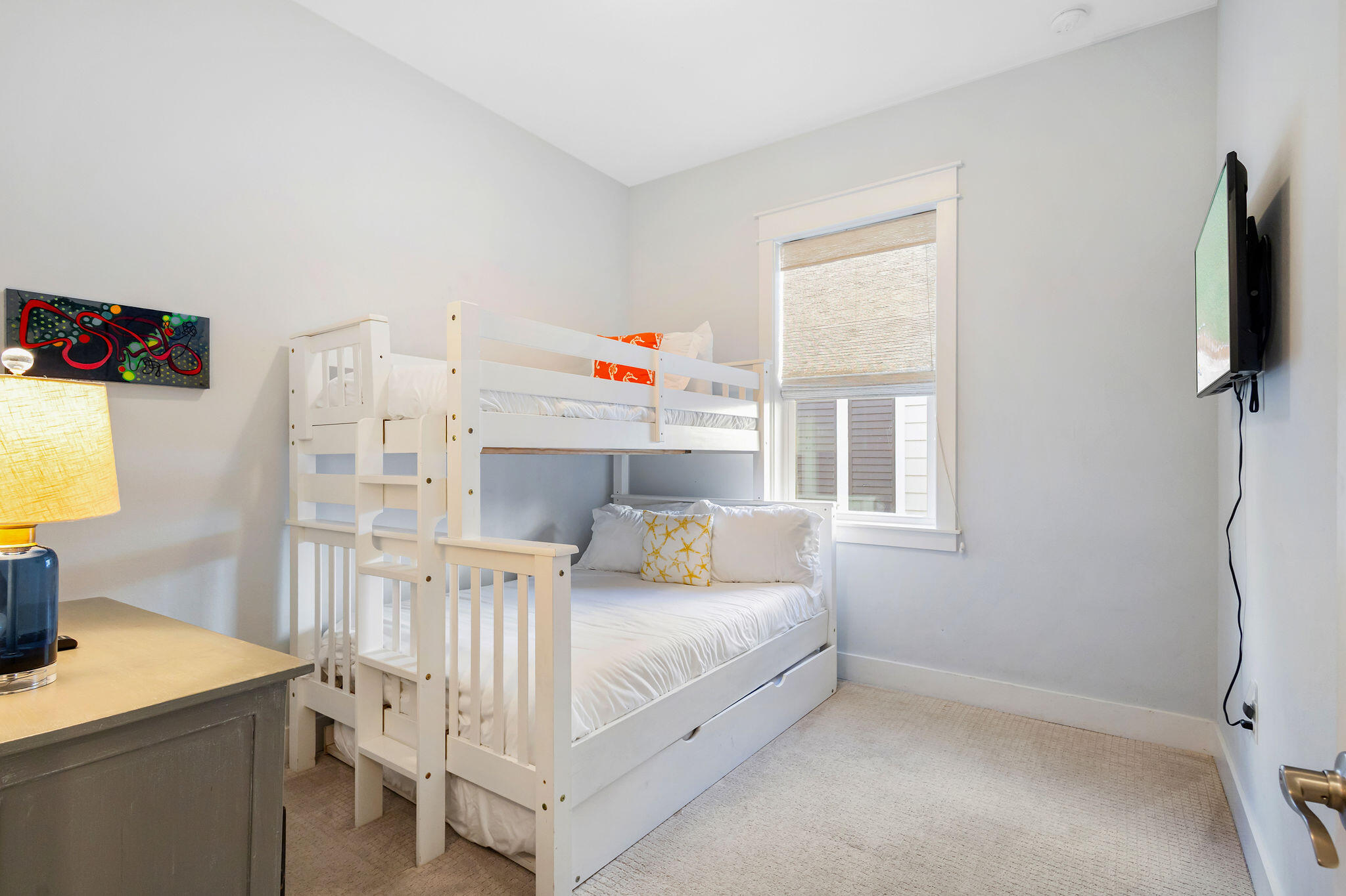 26 East E Pine, Unit A Inlet Beach, FL 32461 - Photo 23 of 53 a bedroom with a bed and flat screen tv