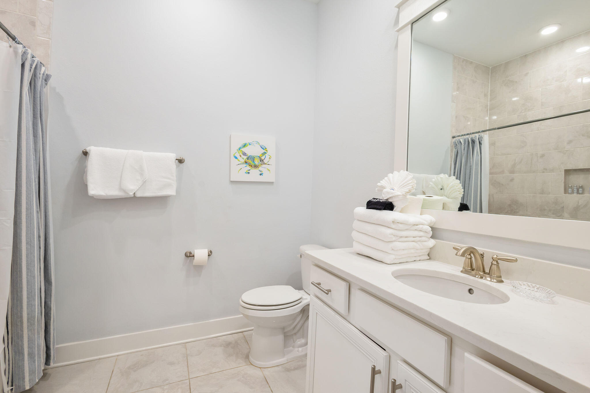26 East E Pine, Unit A Inlet Beach, FL 32461 - Photo 27 of 53 a bathroom with a sink mirror vanity and toilet