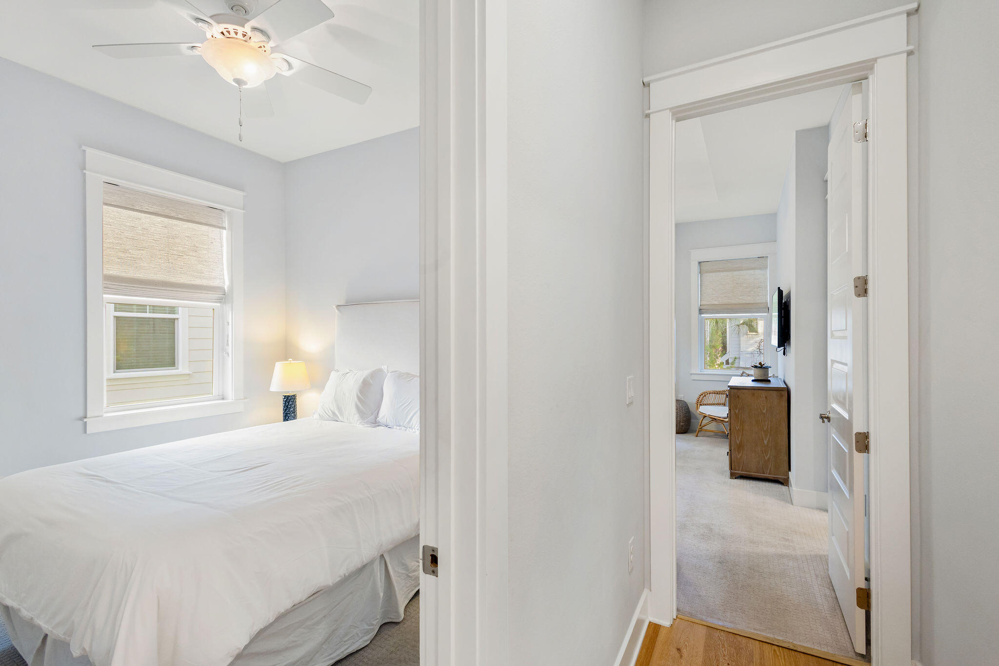 26 East E Pine, Unit A Inlet Beach, FL 32461 - Photo 29 of 53 a bedroom with a bed and a chandelier