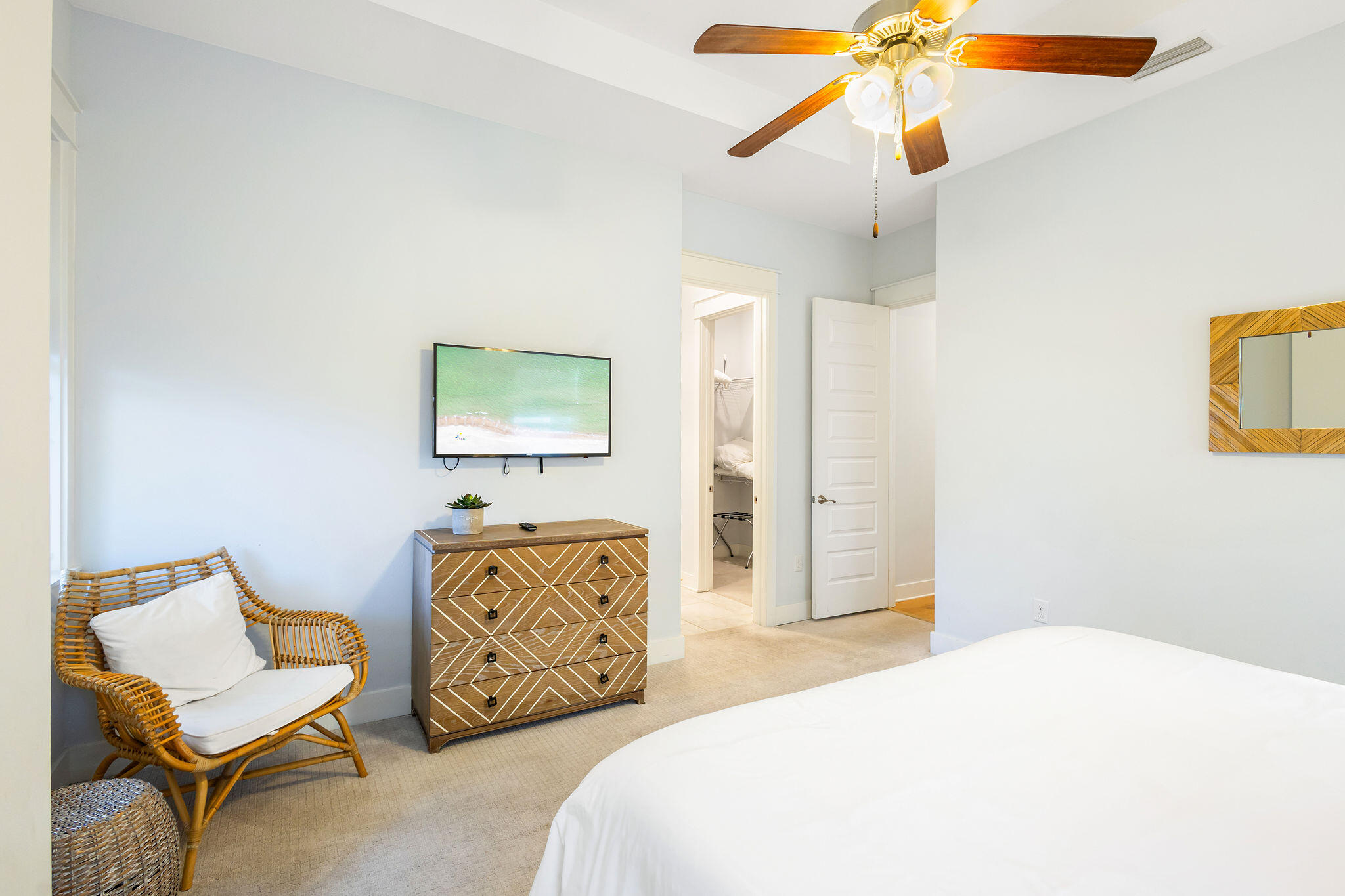 26 East E Pine, Unit A Inlet Beach, FL 32461 - Photo 32 of 53 a bedroom with a bed and a chandelier