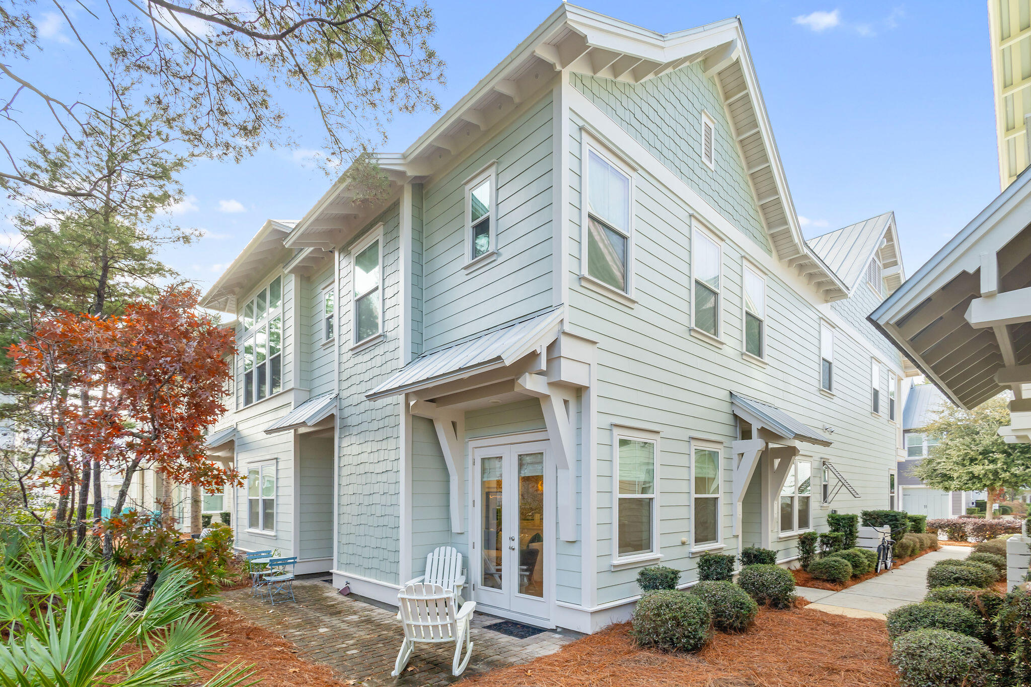 26 East E Pine, Unit A Inlet Beach, FL 32461 - Photo 5 of 53 a view of a white building among the street with palm trees