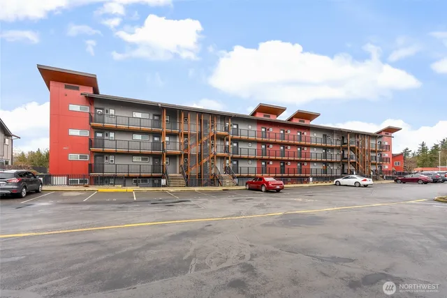 a view of a parked cars in front of a building
