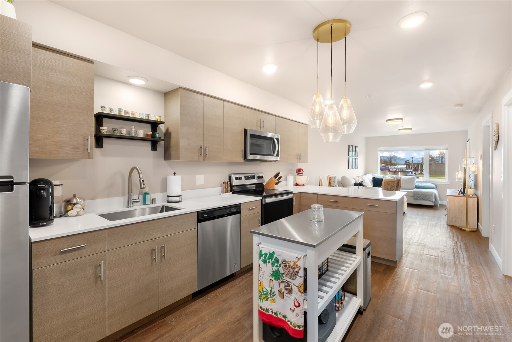 1882 Front Street, Unit 302 Lynden, WA 98264 - Photo 2 of 31 a kitchen with a sink appliances and cabinets