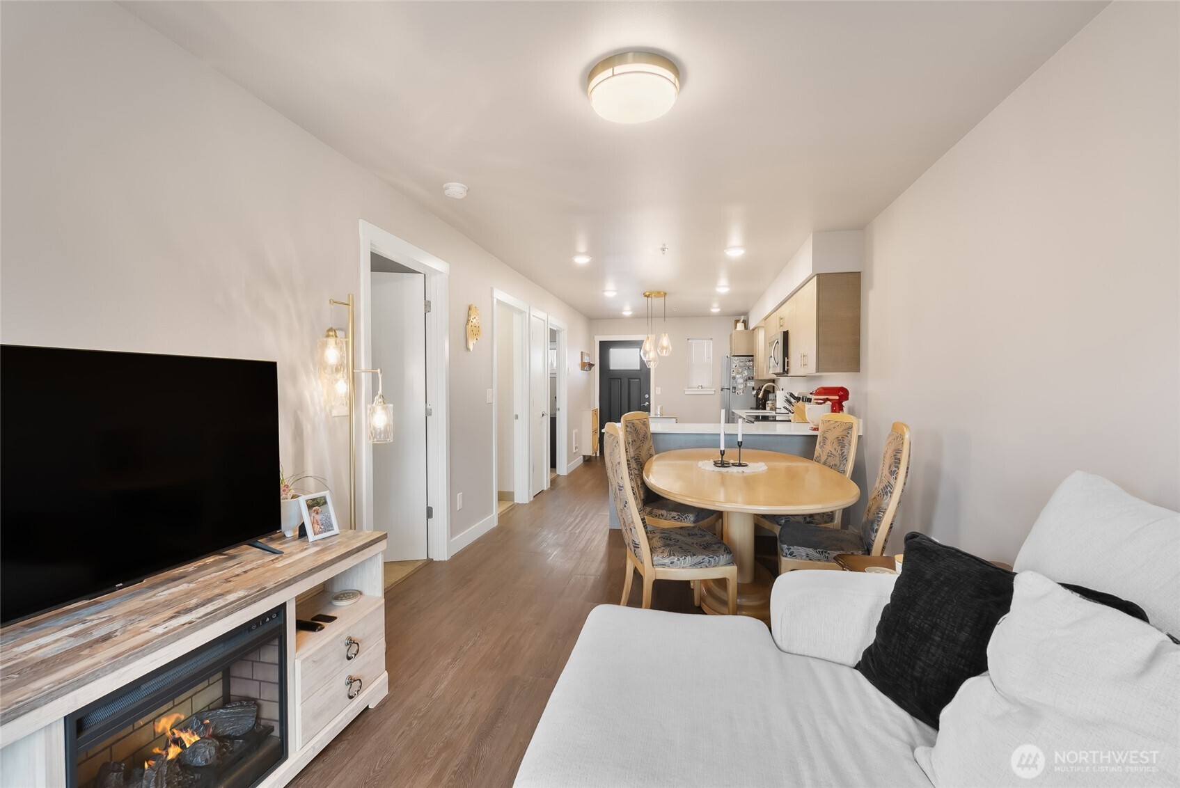 1882 Front Street, Unit 302 Lynden, WA 98264 - Photo 6 of 31 a living room with furniture and a flat screen tv