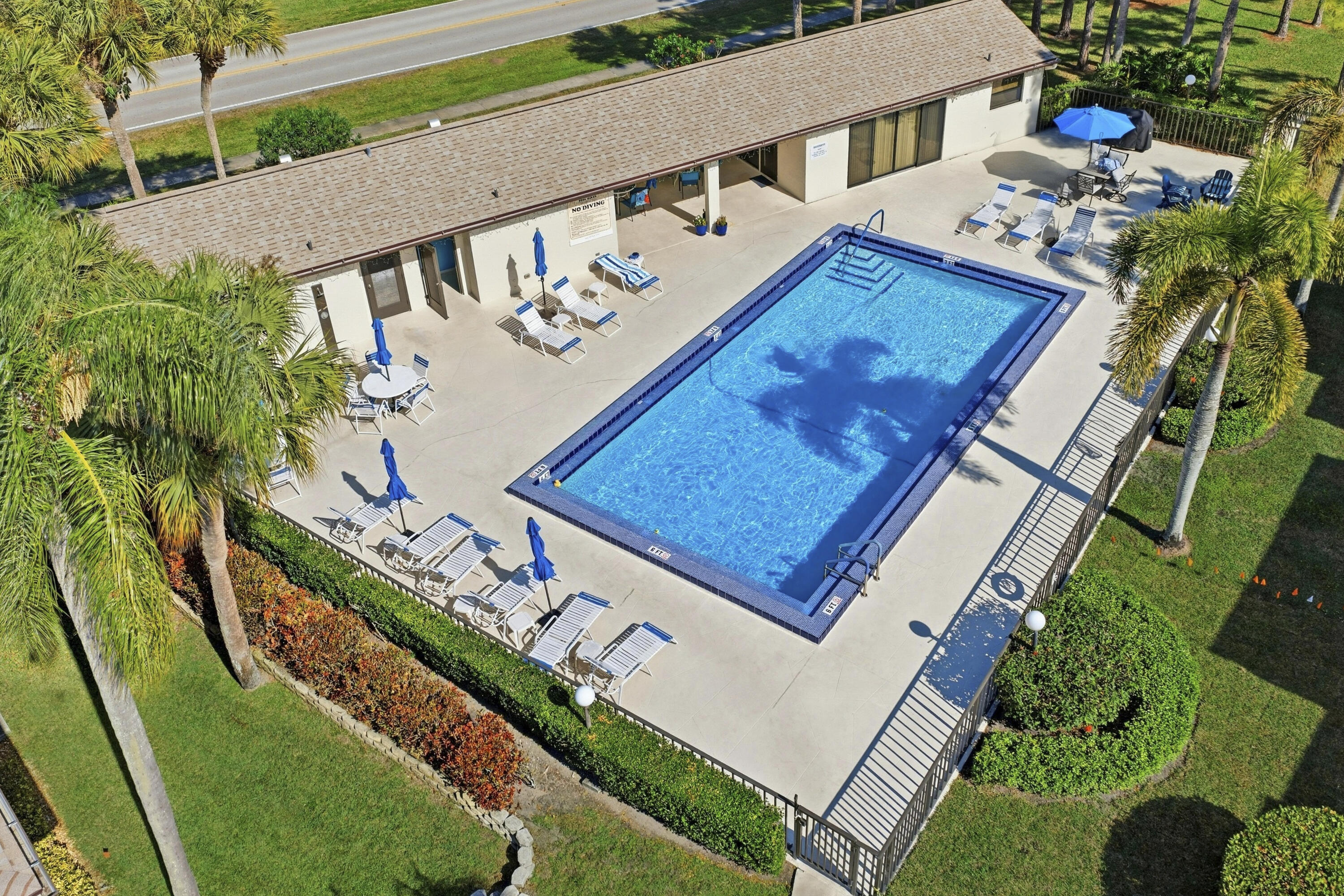 802 Wingfoot Drive, Unit B Jupiter, FL 33458 - Photo 22 of 30 DJI_20260124133403_0150_D_with_grass