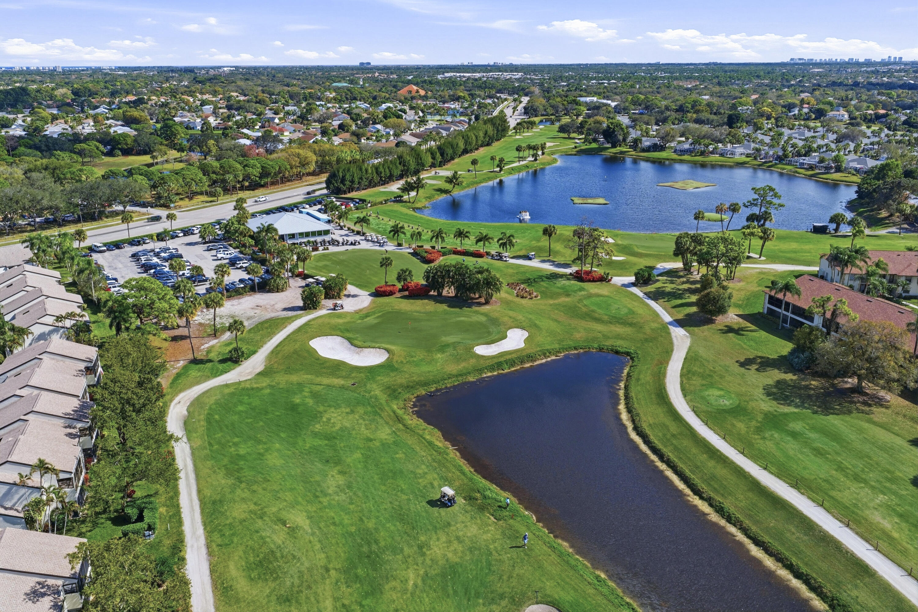 802 Wingfoot Drive, Unit B Jupiter, FL 33458 - Photo 24 of 30 DJI_20260124133427_0155_D_with_grass