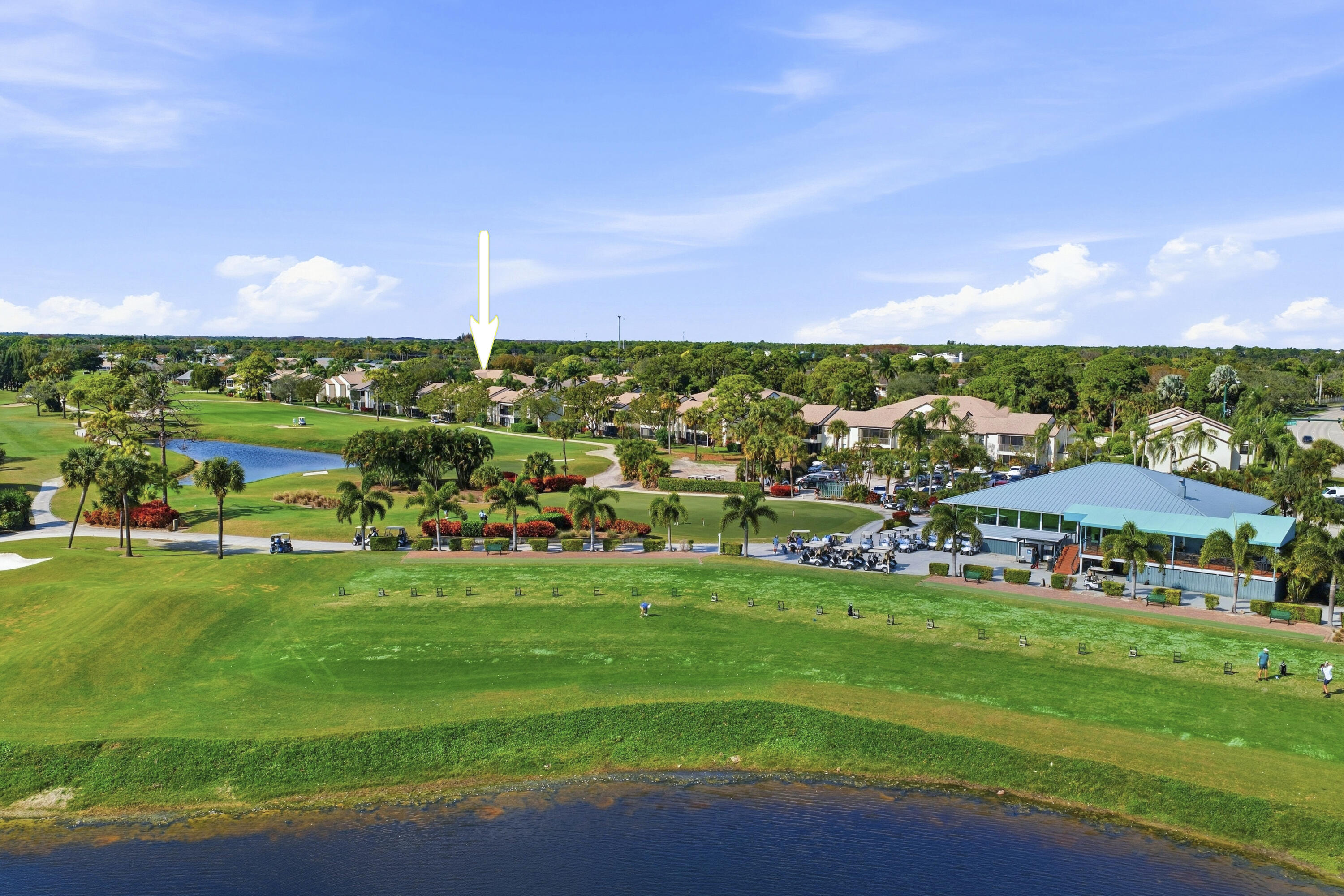 802 Wingfoot Drive, Unit B Jupiter, FL 33458 - Photo 27 of 30 DJI_20260124133536_0165_D_with_grass