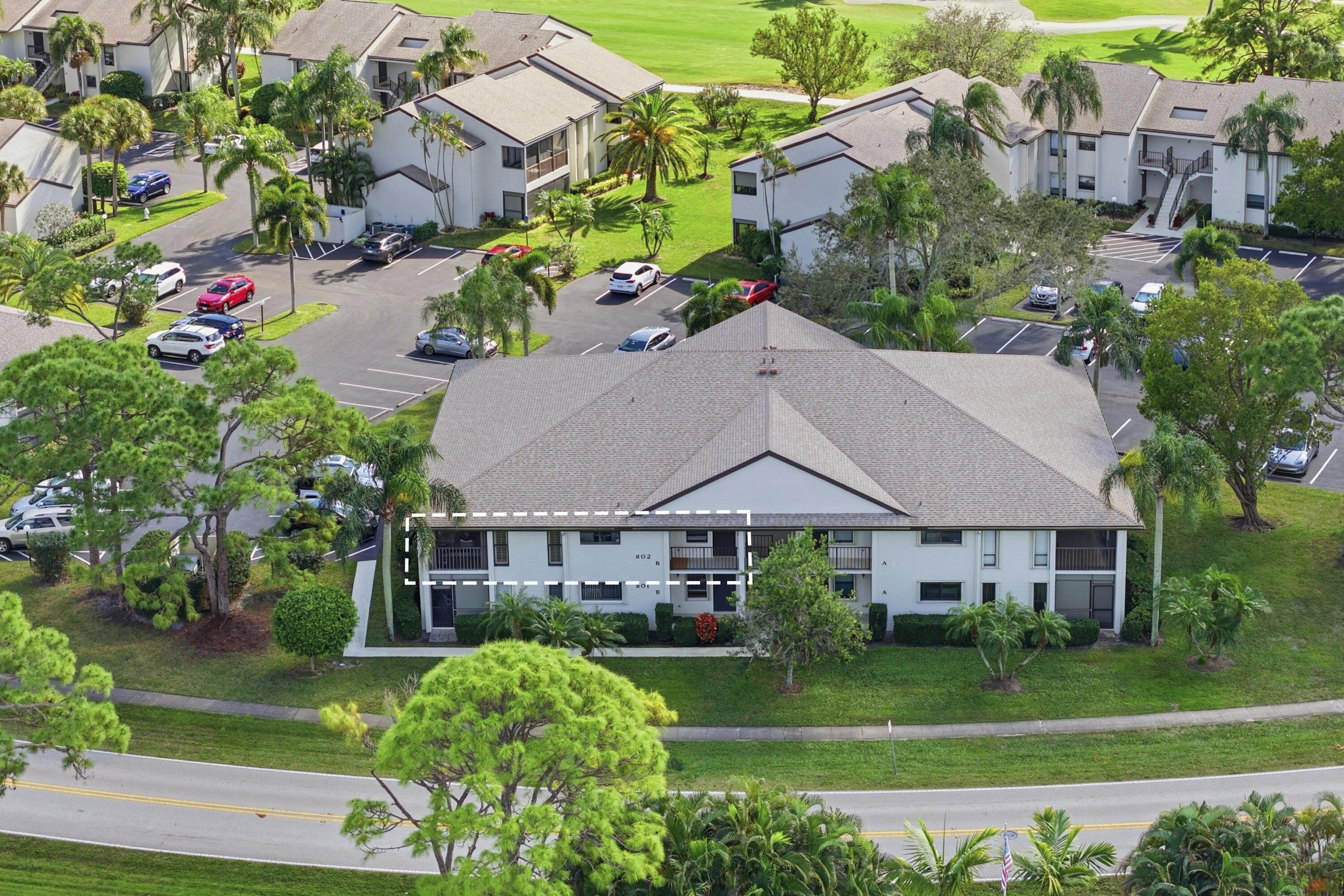 802 Wingfoot Drive, Unit B Jupiter, FL 33458 - Photo 29 of 30 DJI_20260124133928_0175_D_with_grass