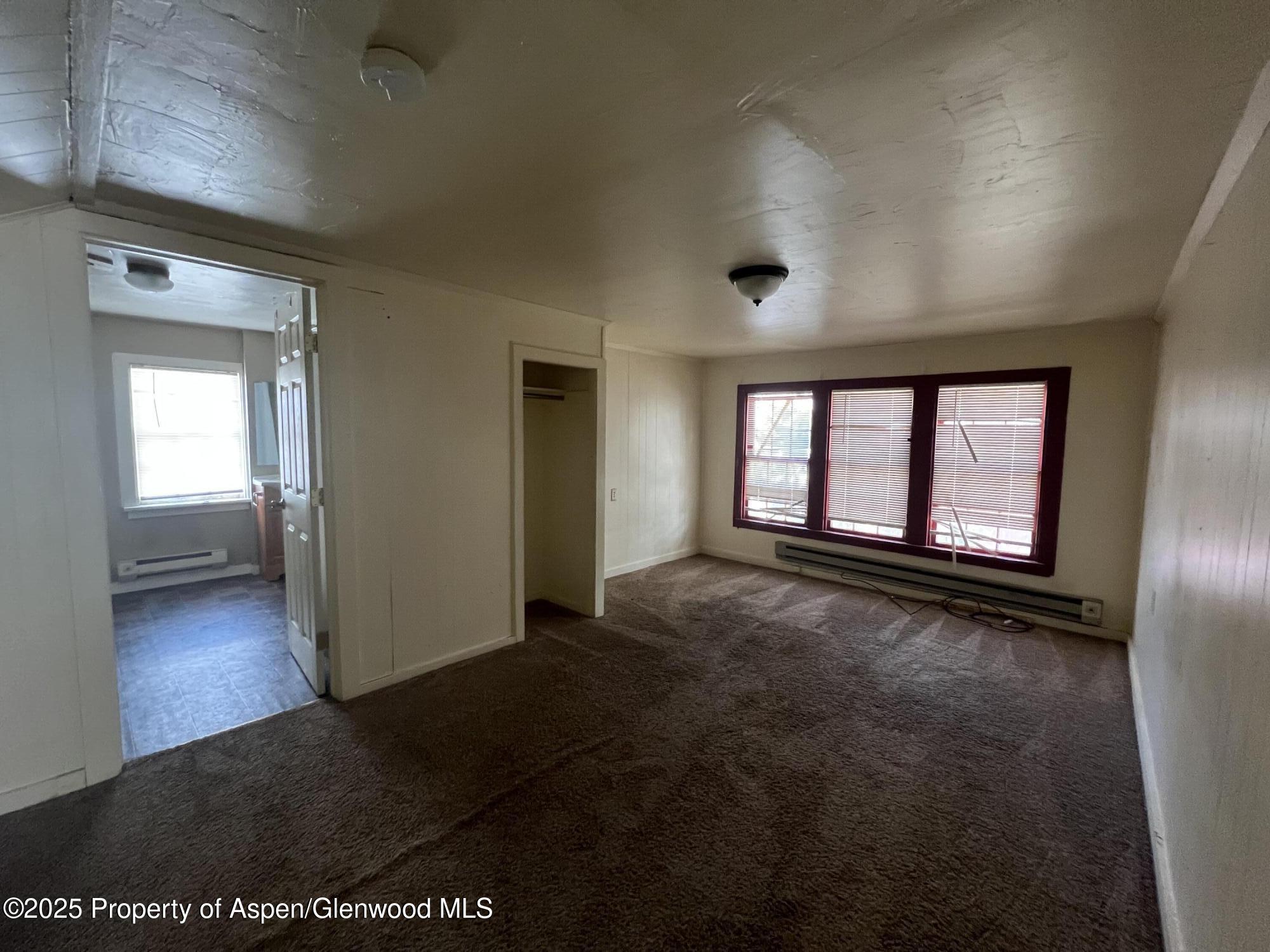 567 1/2 School Street Craig, CO 81625 - Photo 3 of 5 a view of an empty room and window