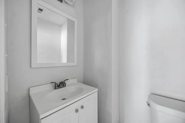 a bathroom with a sink and a vanity
