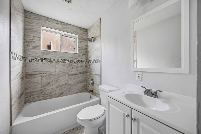 12659 Chiswick Road Houston, TX 77047 - Photo 16 of 21 a bathroom with a sink toilet and shower