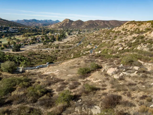 a view of a large mountain with mountains in the background
