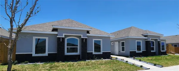 front view of a house with a yard