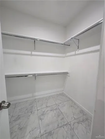 a view of an empty walk in closet