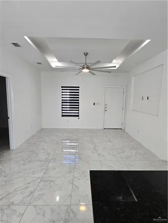 a view of a livingroom with a kitchen