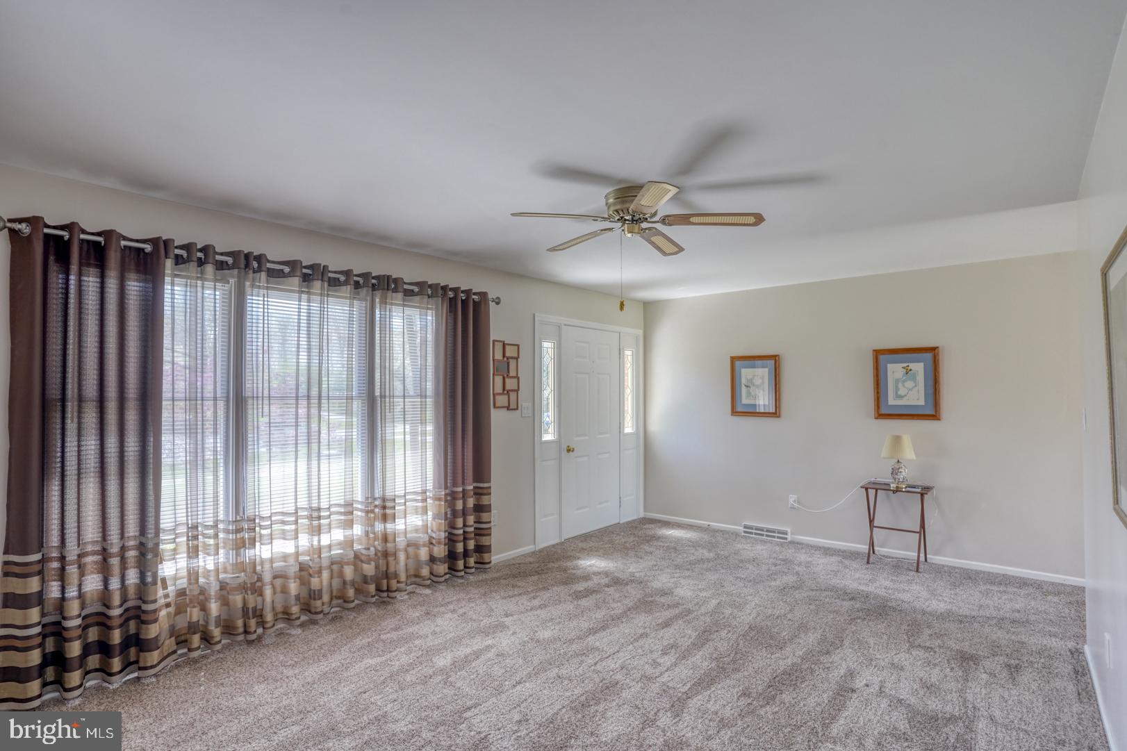 20 Tammie Drive Bear, DE 19701 - Photo 13 of 37 an empty room with windows and fan