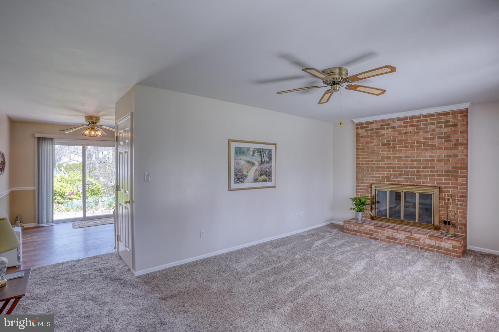 20 Tammie Drive Bear, DE 19701 - Photo 14 of 37 a view of an empty room with a fireplace and a window