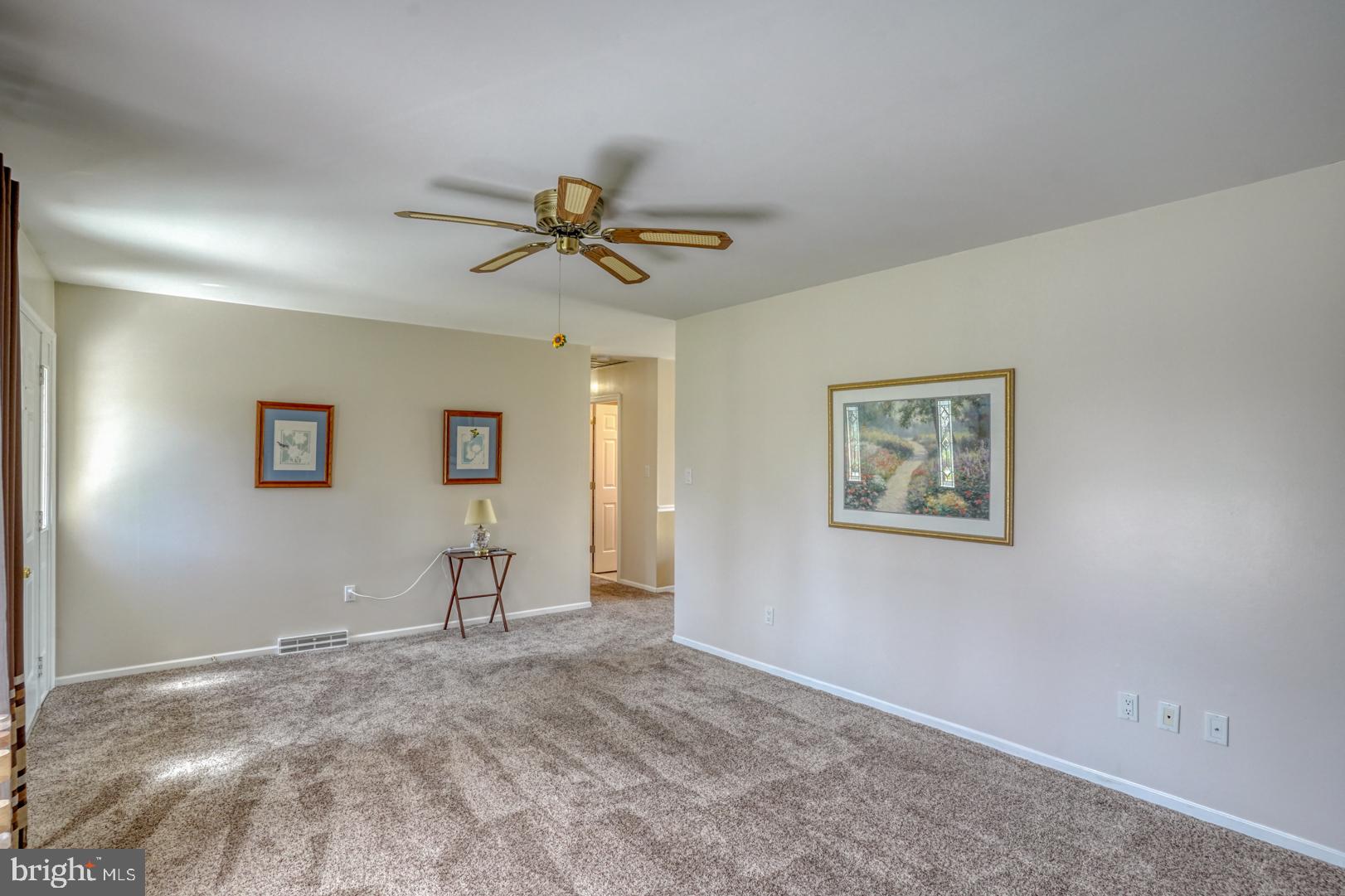 20 Tammie Drive Bear, DE 19701 - Photo 15 of 37 a view of a livingroom with a chandelier fan and windows