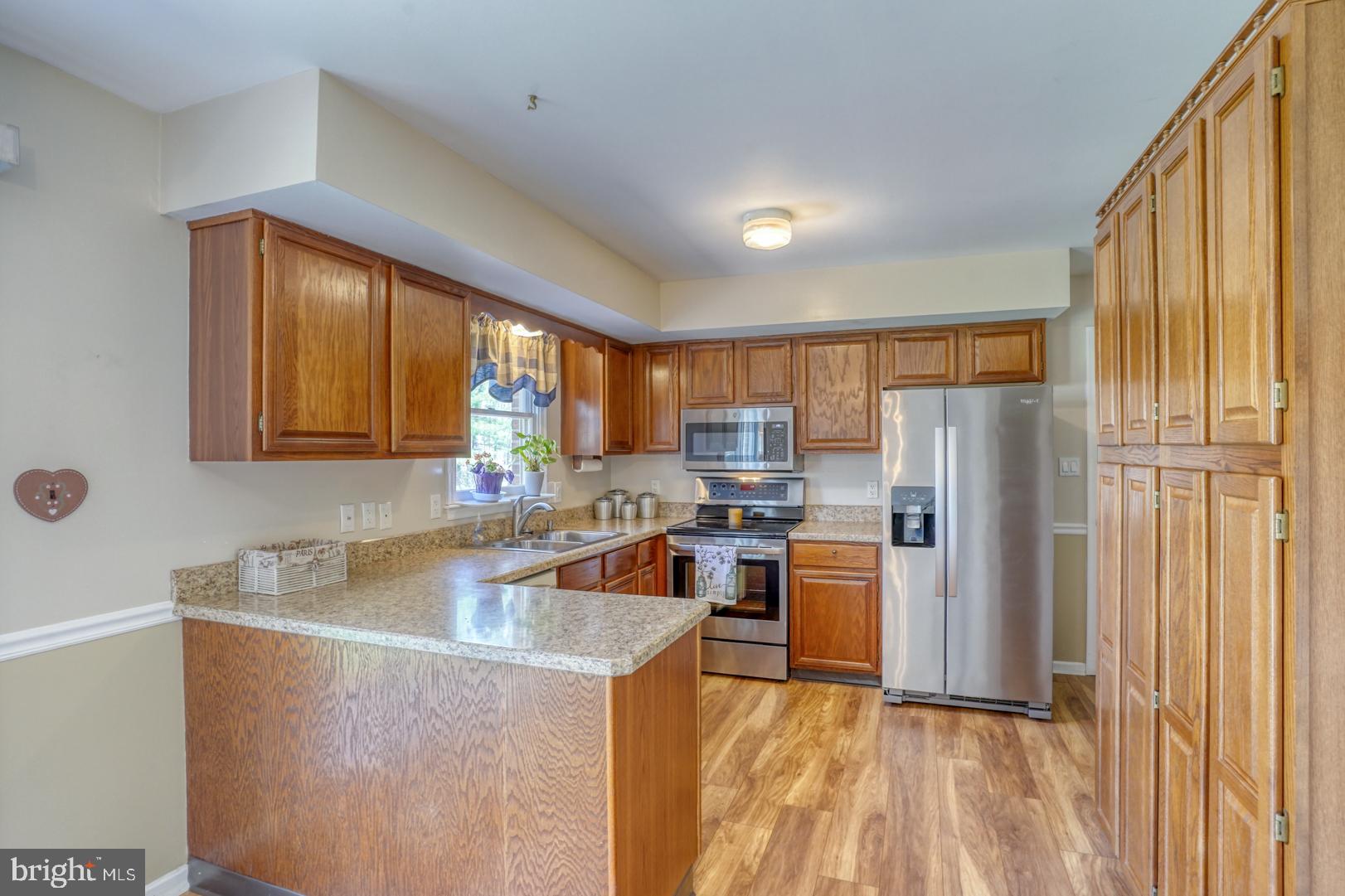20 Tammie Drive Bear, DE 19701 - Photo 17 of 37 a kitchen with refrigerator and window