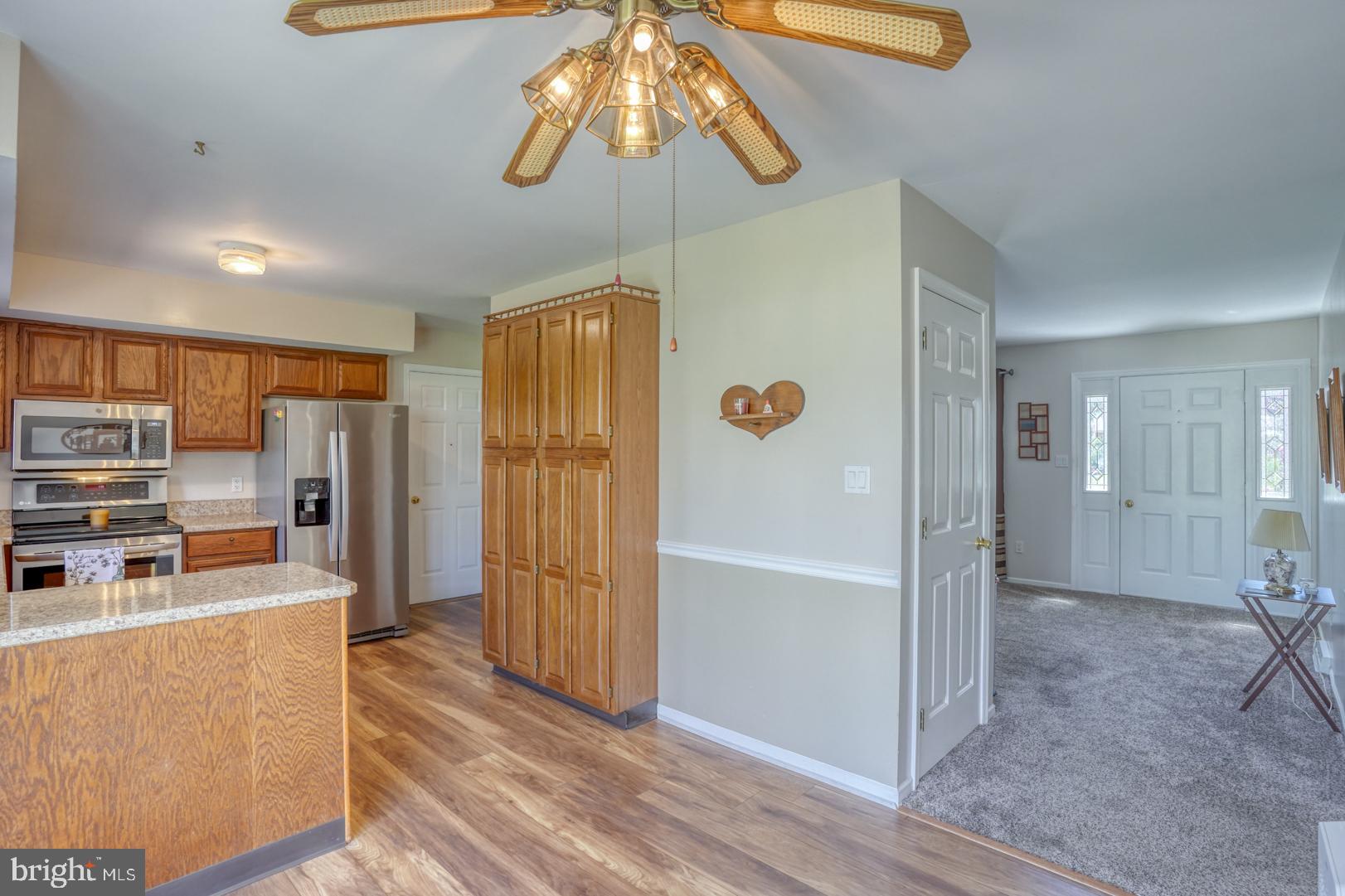 20 Tammie Drive Bear, DE 19701 - Photo 19 of 37 a kitchen view with stainless steel appliances a refrigerator and cabinets