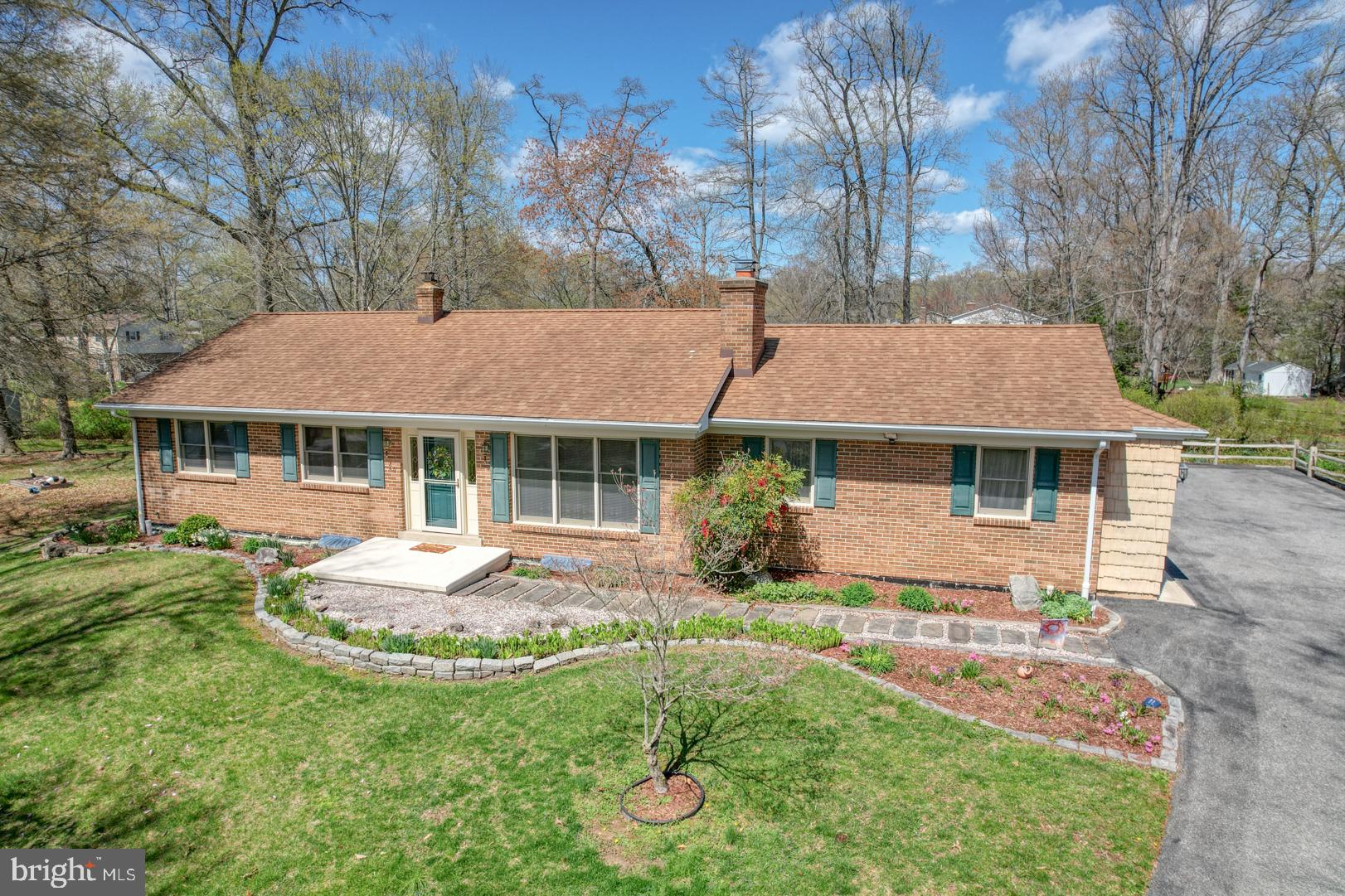20 Tammie Drive Bear, DE 19701 - Photo 2 of 37 a front view of a house with a yard table and chairs