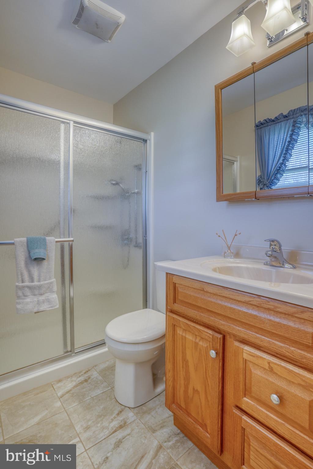20 Tammie Drive Bear, DE 19701 - Photo 24 of 37 a bathroom with a sink a toilet and shower