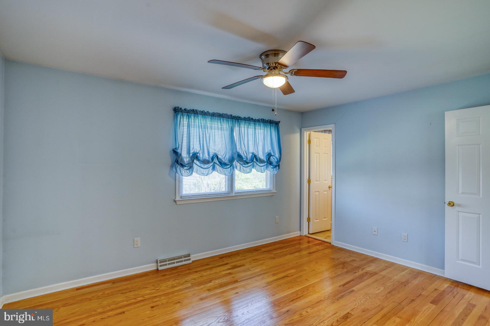 20 Tammie Drive Bear, DE 19701 - Photo 25 of 37 a view of an empty room with wooden floor and window